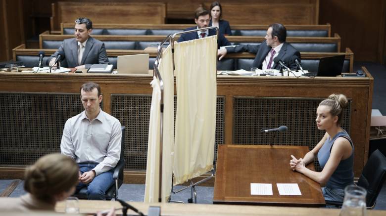 Nadia Parkes and Julian Swiezewski in a courtroom with a screen separating them