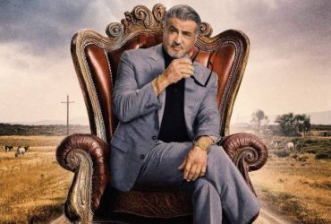 Tulsa King Season 2 Key Art Sylvester Stallone sitting in a throne like chair.